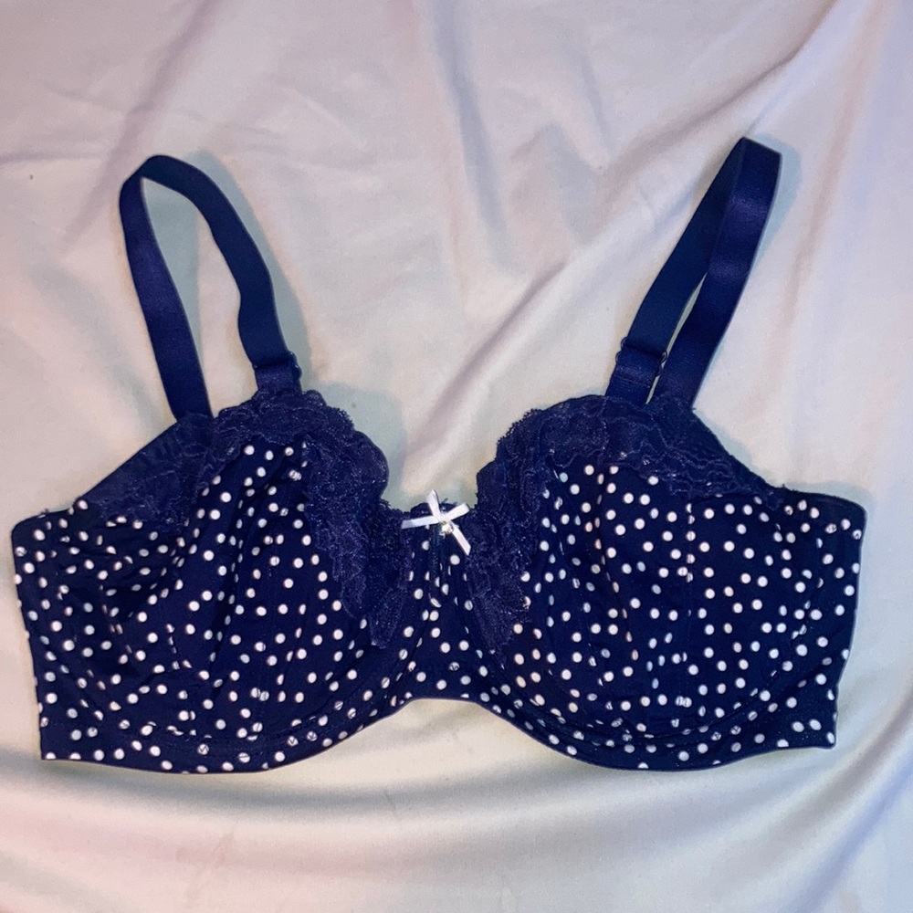 Unpadded navy and white polka dot bra with lace detail